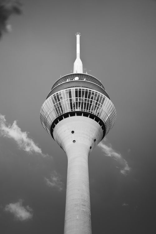 Free A striking black and white image of the iconic Rhine Tower in Düsseldorf, Germany. Stock Photo