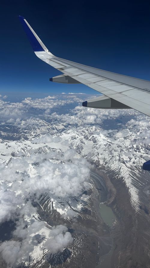 Free Stunning aerial view of the snow-capped Himalayan mountains from an airplane with clear skies. Stock Photo