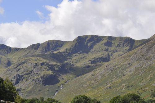 Free Scenic mountain view with lush greenery and dramatic skies in England. Stock Photo