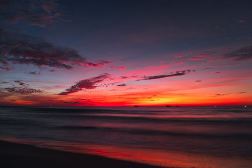 Free Colorful sunset over the ocean at Quảng Trị, Vietnam, with vivid sky hues. Stock Photo