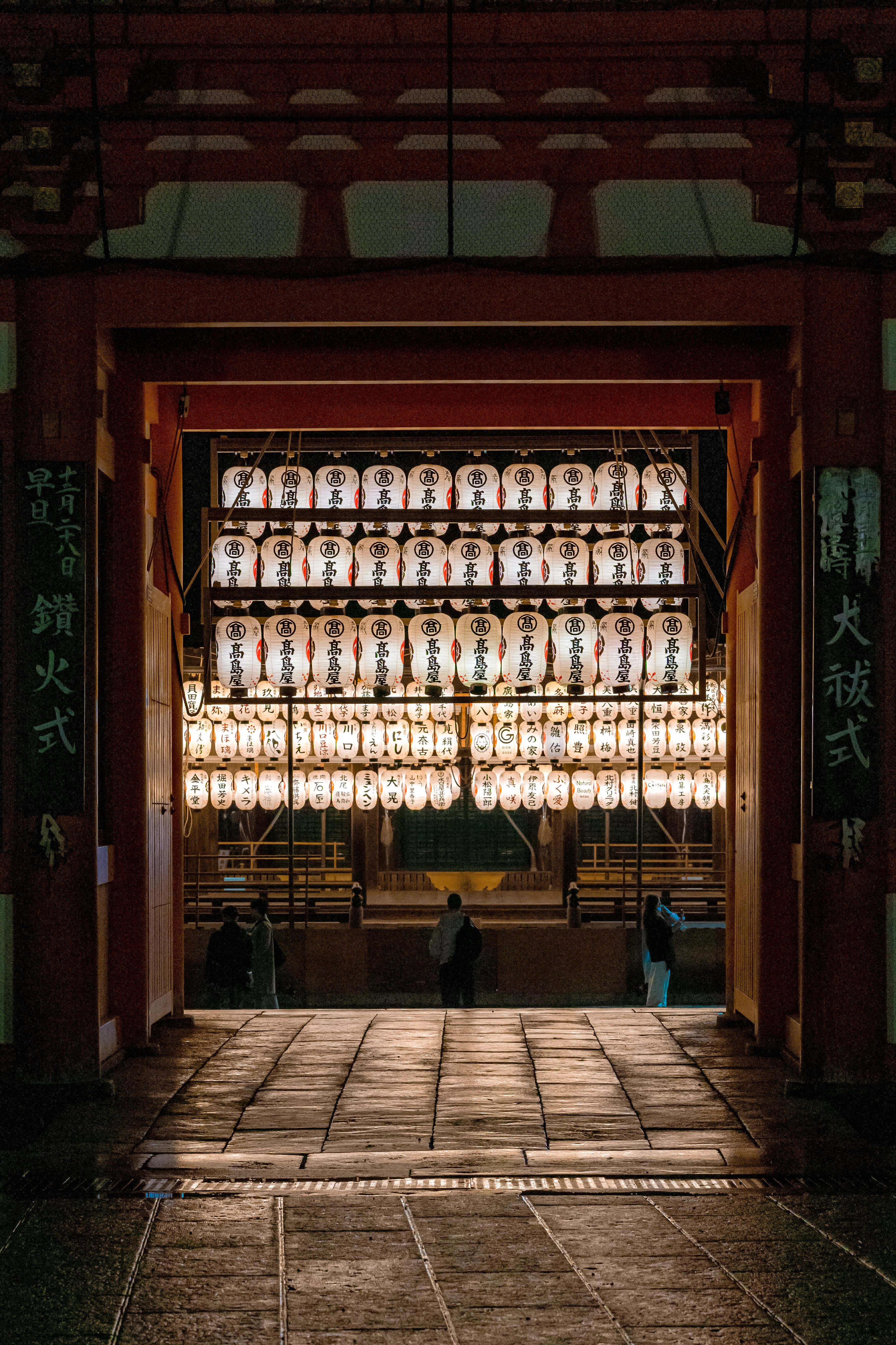 A captivating night view of Yasaka Shrine with traditional lanterns glowing, located in the heart of Kyoto, Japan.