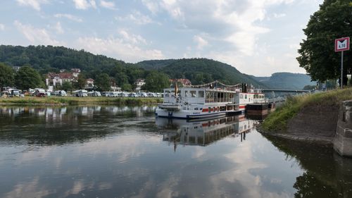 Free Idyllic riverside scene with a ferry in Bad Karlshafen, Germany. Stock Photo