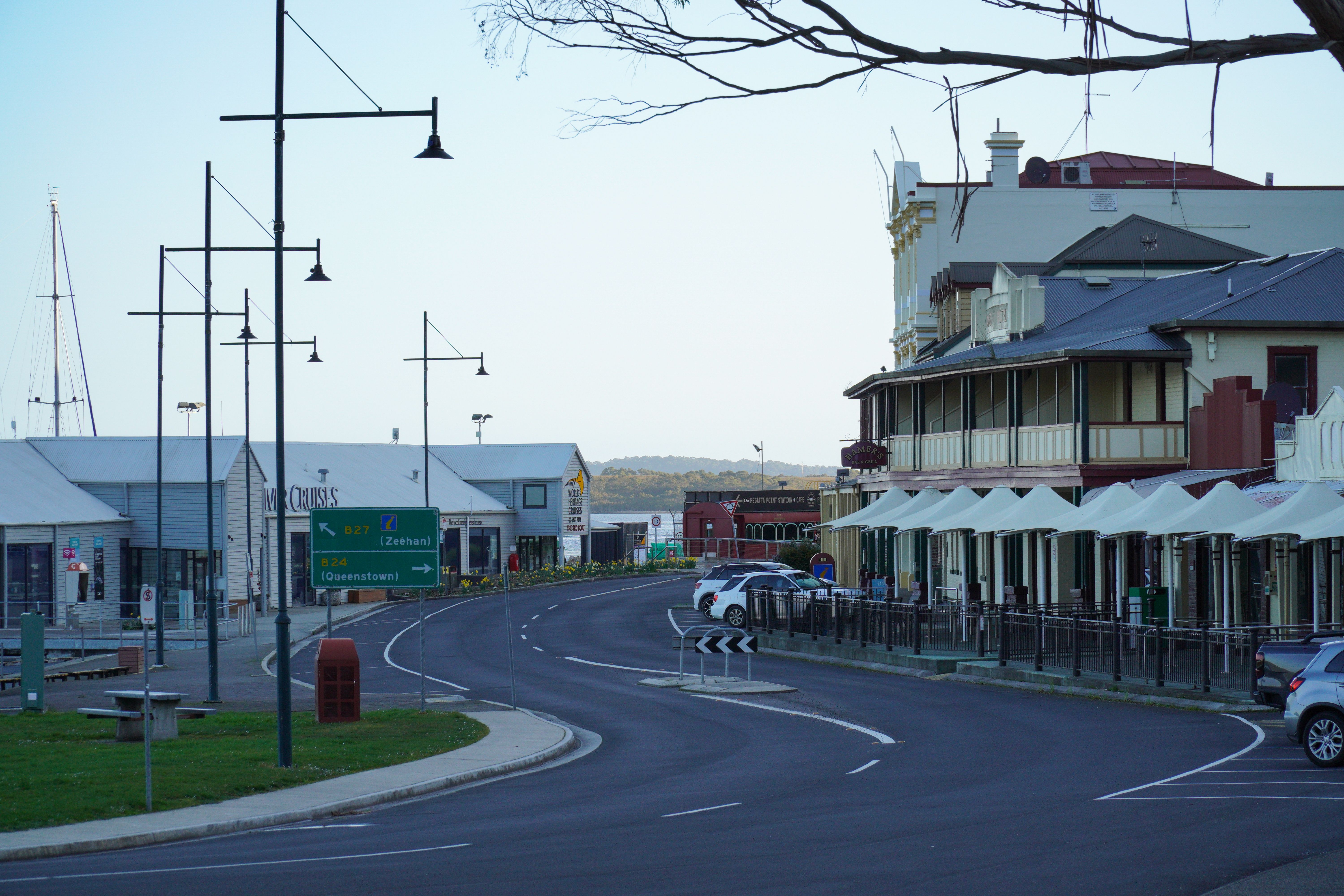 A scenic street in Strahan, Tasmania, showcasing historic buildings and modern architecture