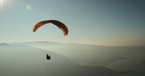 Free Man Using Parachute Stock Photo