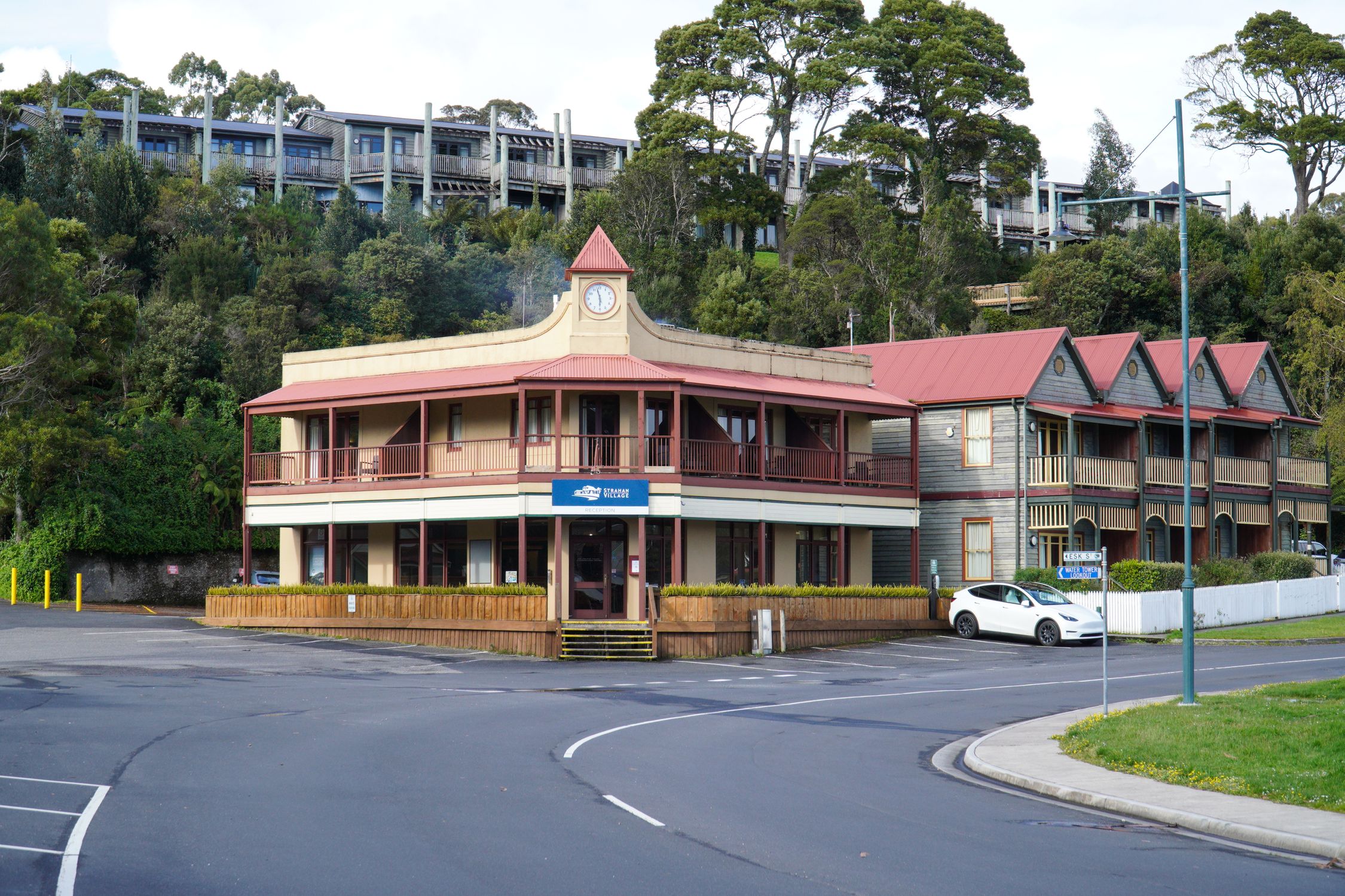Charming Victorian architecture in Strahan, Tasmania, surrounded by lush greenery