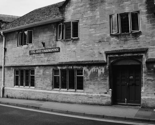 Free Black and white photo of The Greyhound Inn, a historic pub in Stroud, UK. Stock Photo