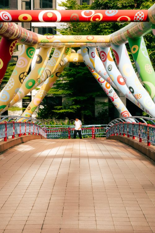 Free Colorful modern helix bridge in Singapore with artistic design, photographed during the day. Stock Photo
