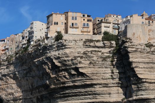 Scenic view of Bonifacio's stunning cliffside architecture under a clear blue sky.