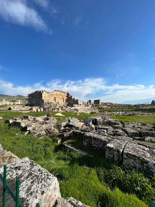 Free Explore the historic ruins of Laodicea in Turkey with lush greenery under a bright blue sky. Stock Photo