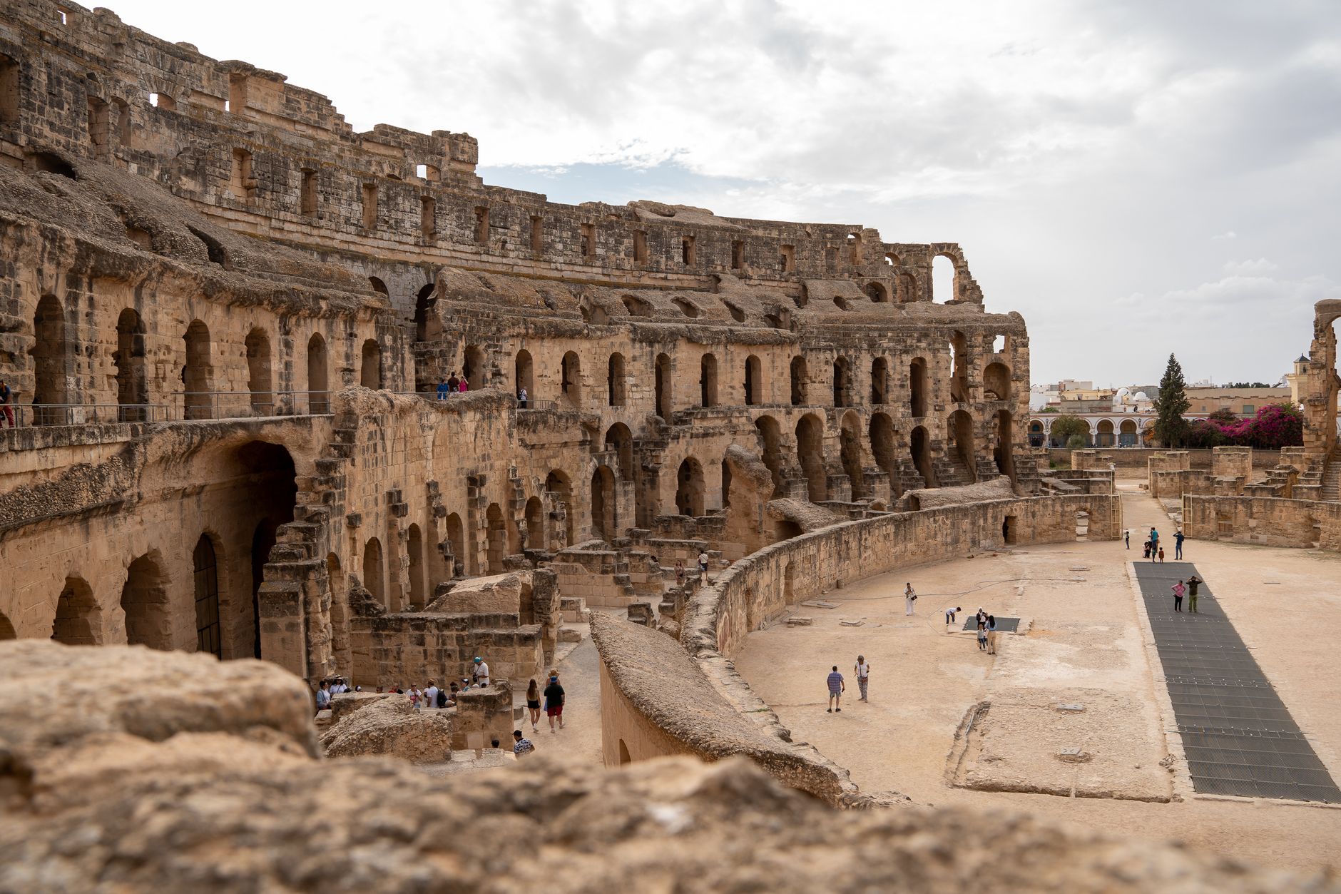 The historic El Jem Amphitheatre in Tunisia, an iconic Roman structure, attracts tourists worldwide with its grandeur.