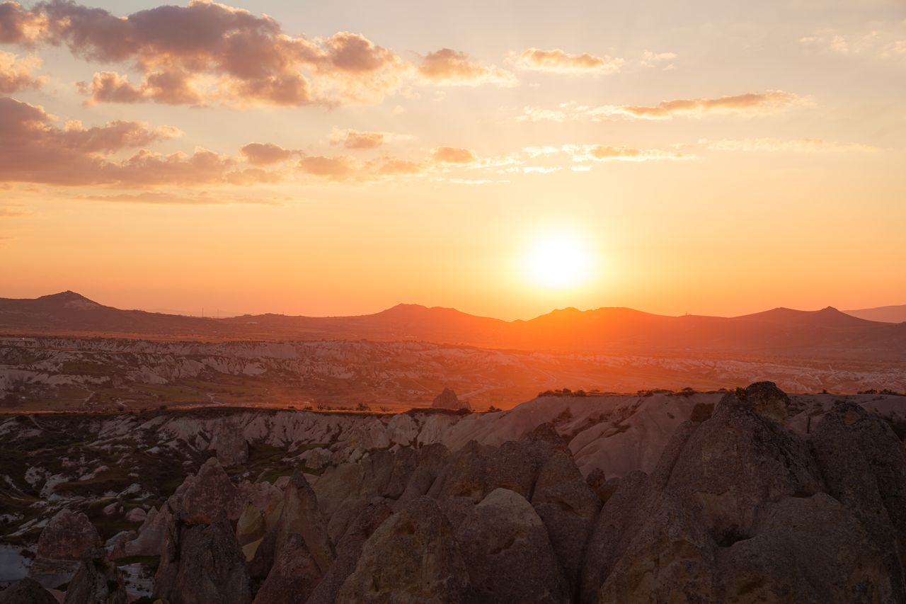 capture of a breathtaking sunset over the rock formations in cappadoci