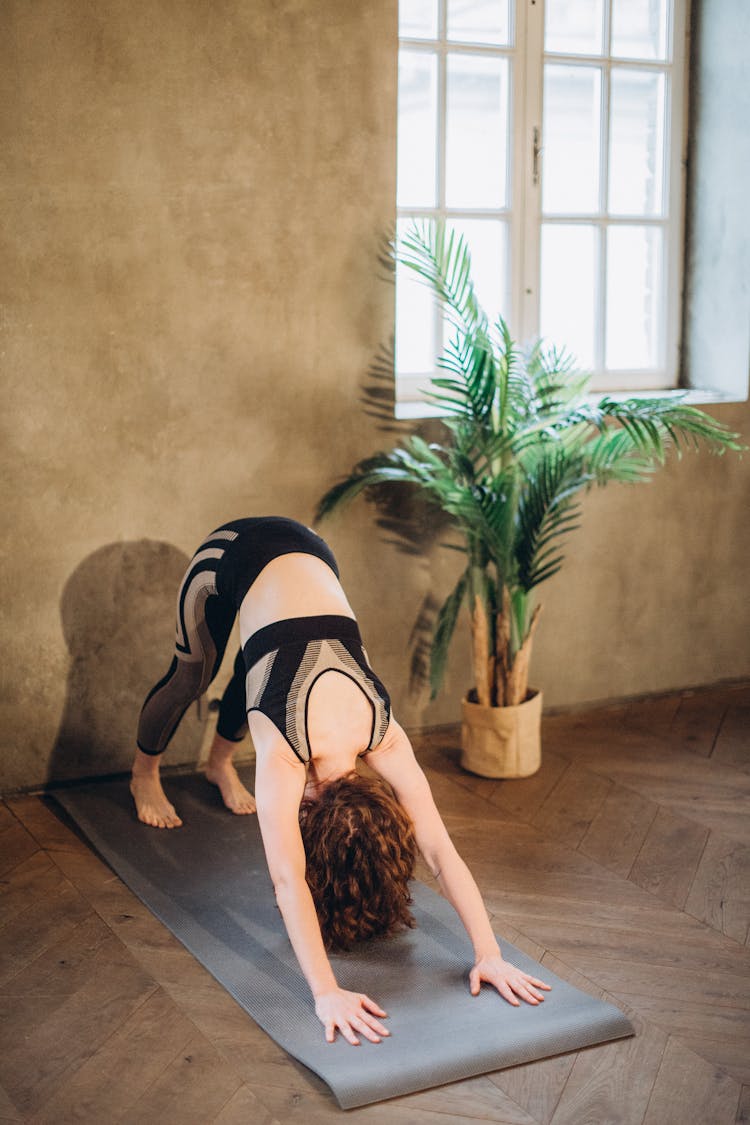 Woman In Downward Dog Pose