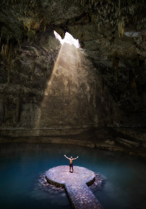 Free Person Standing Under the Sunbeam Stock Photo