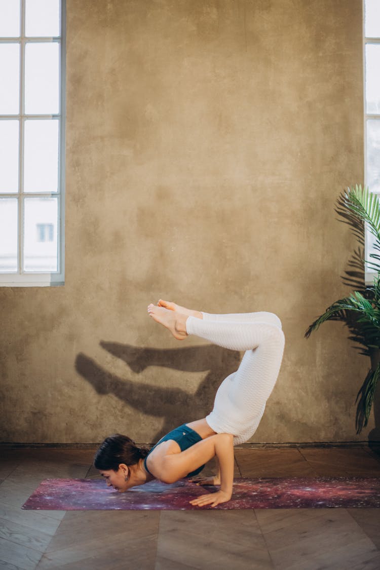 Woman In Scorpion Pose