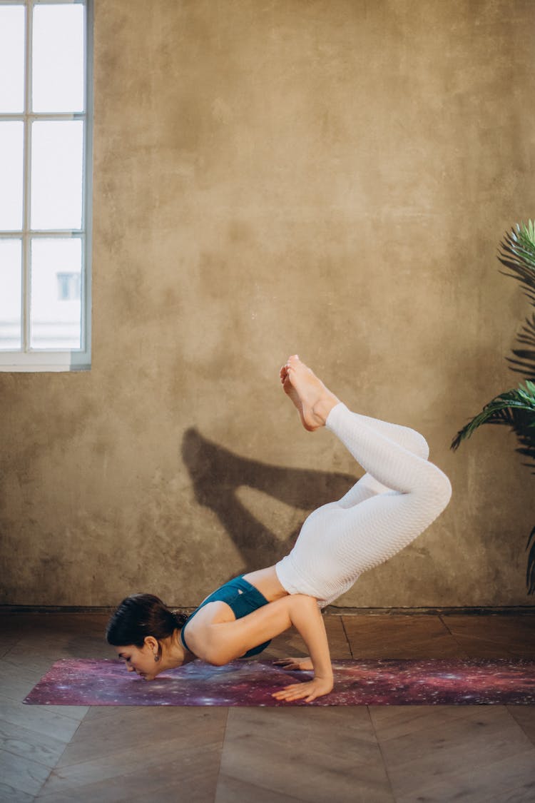 Woman In Scorpion Pose