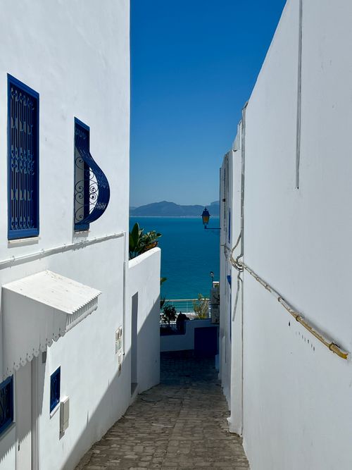 Free Charming white alleyway in Carthage, Tunisia with a stunning view of the Mediterranean Sea. Stock Photo