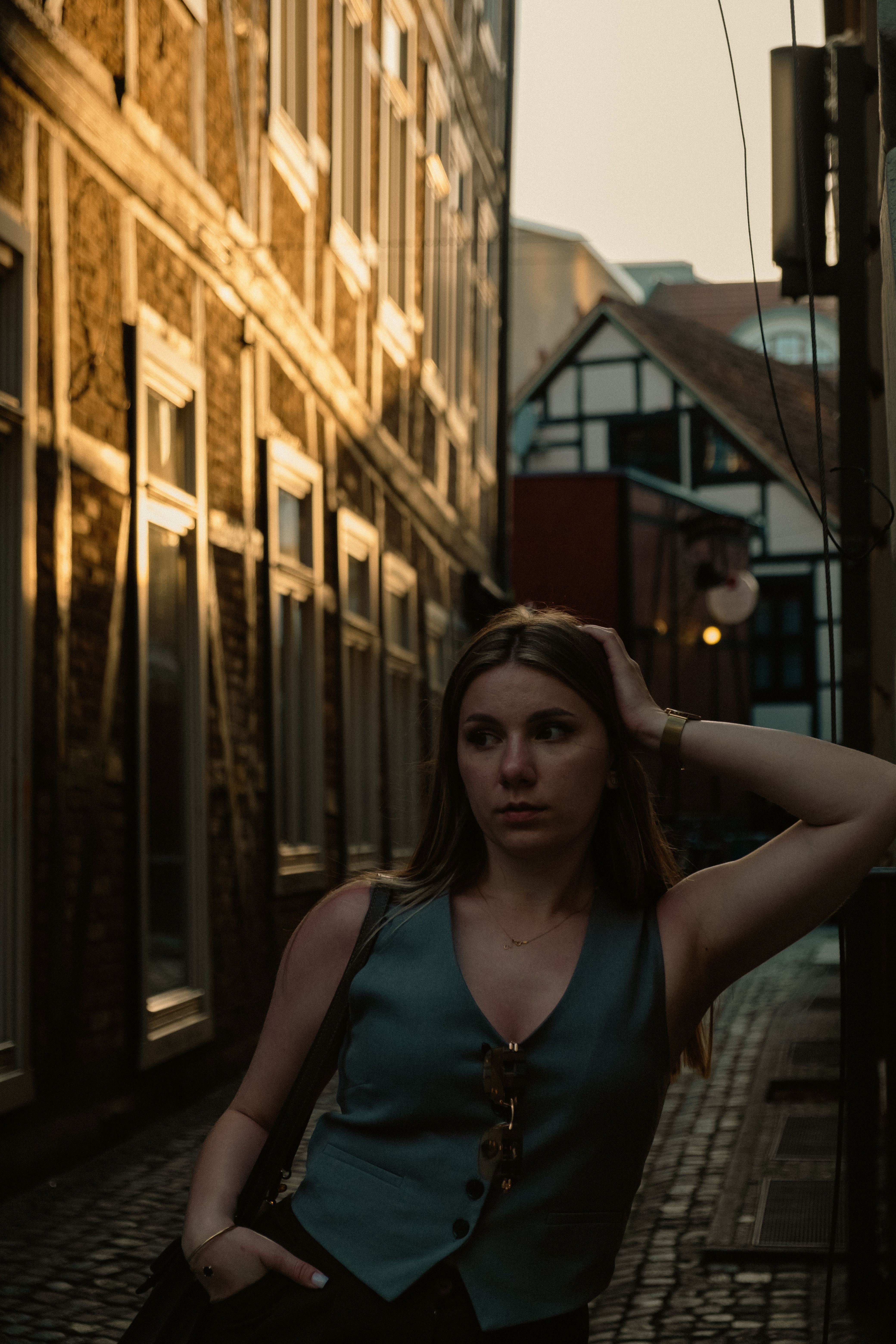 Portrait of a young woman in a narrow European alley with soft sunset lighting creating a warm ambiance.. pexels, portrait, y