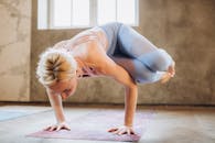 Woman in Sports Bra and Leggings Doing Yoga
