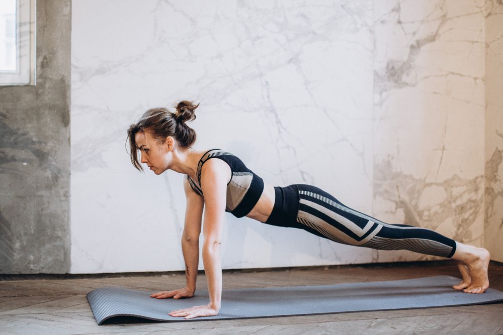 Controlled plank position on a mat