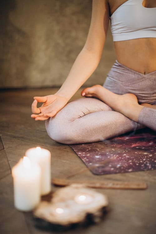 Free Meditating With Candles and Incense Stock Photo