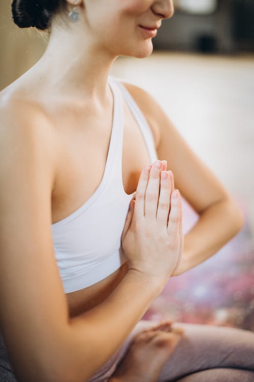 Free Woman Meditating in Lotus Pose Stock Photo