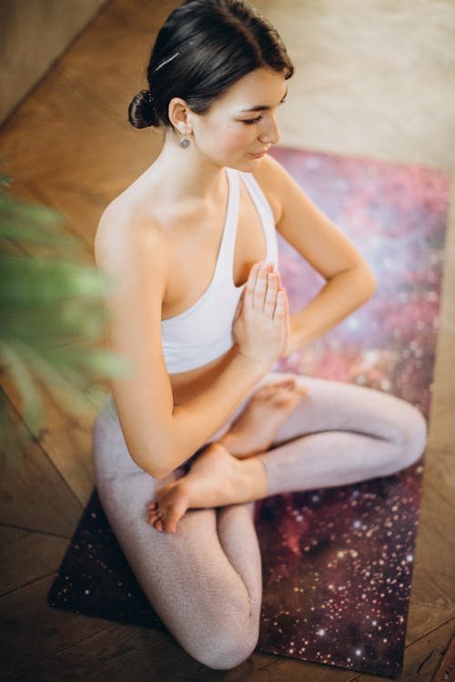 Free Woman Practicing Yoga Stock Photo