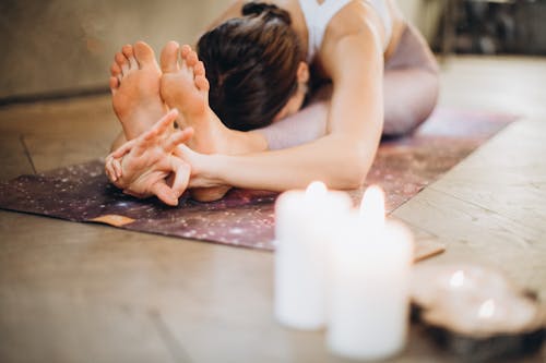 Free Woman Practicing Yoga Stock Photo