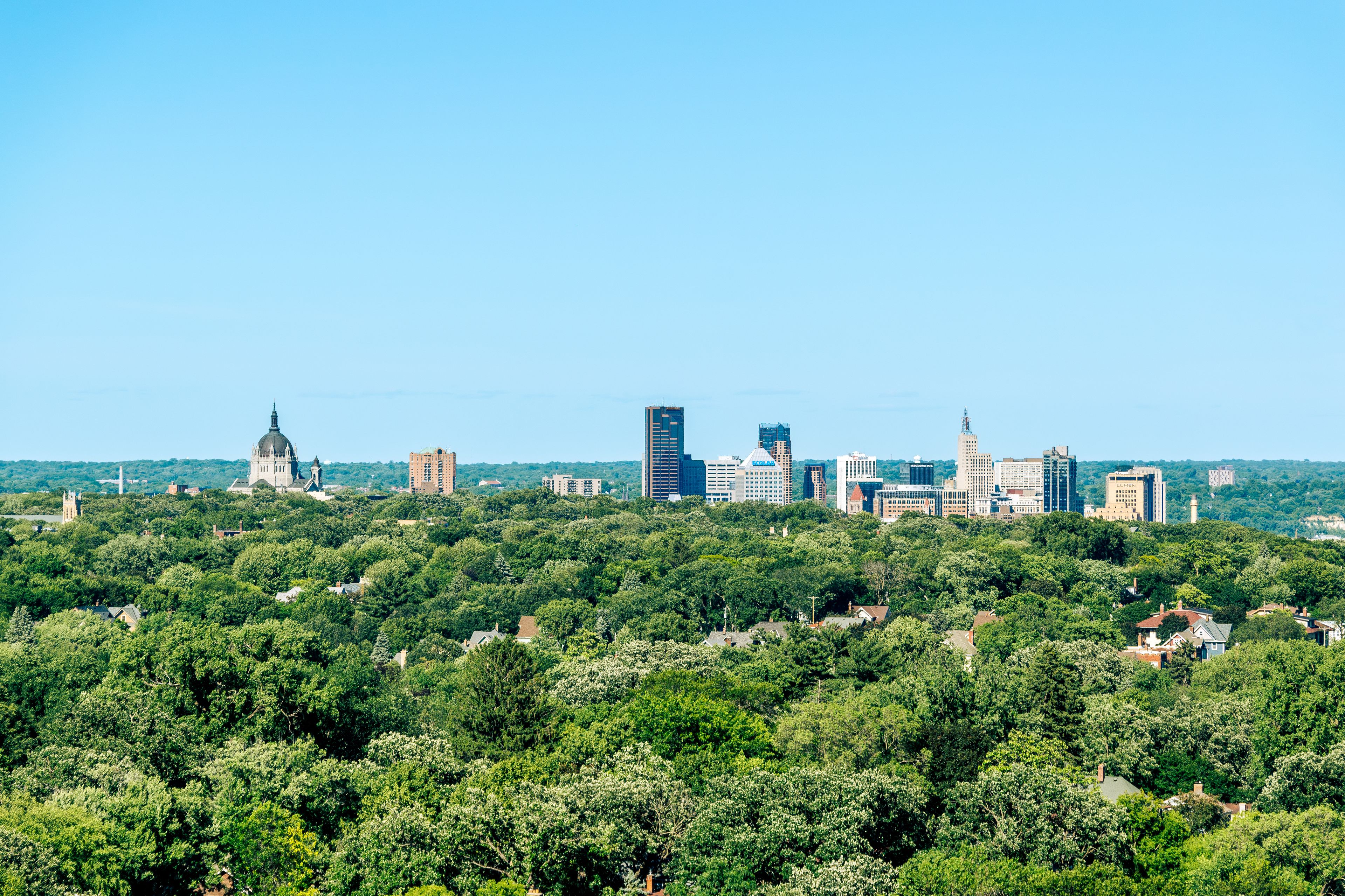 Eagan: St. Paul skyline above leafy neighborhoods