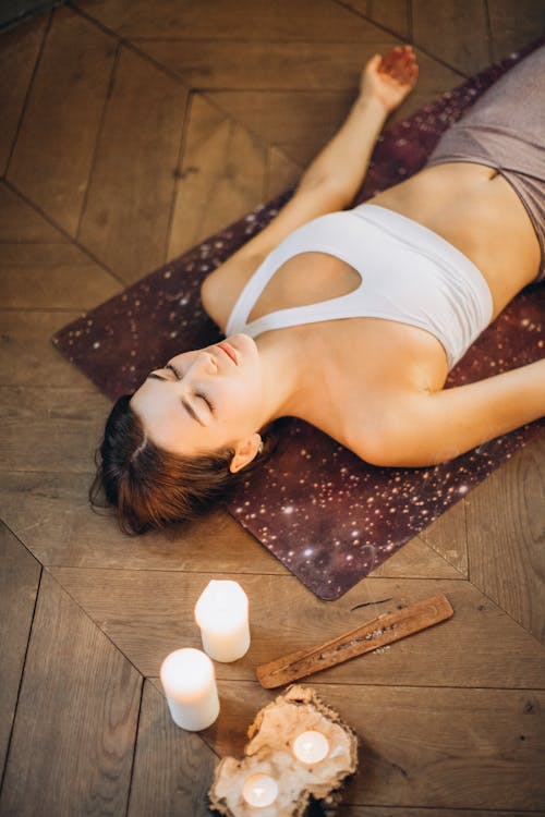 Free Woman Relaxing in Yoga Mat Stock Photo