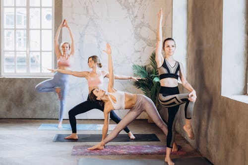 Women in Activewear Doing Yoga