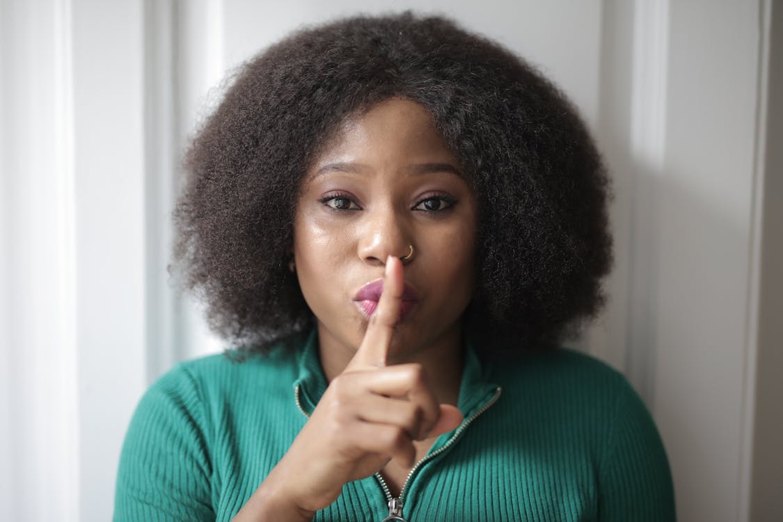 Free Woman Doing Shh Hand Gesture Stock Photo