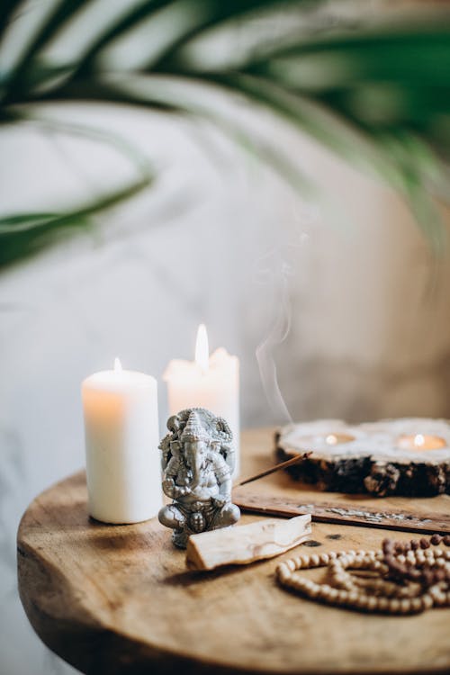 Free Brown Wooden Table With Candles and Incense Stock Photo