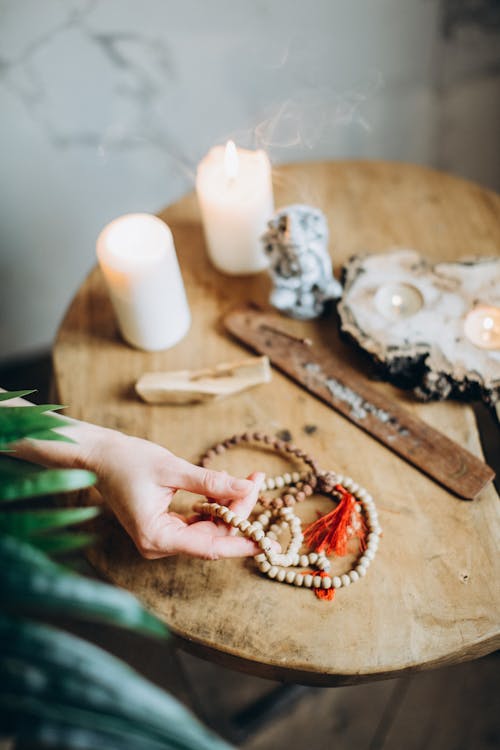 Hand Holding Prayer Beads