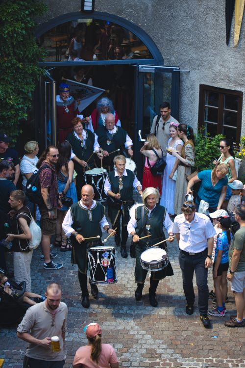 Free Drummers leading a crowd during a lively festival in Kapfenberg, Austria. Stock Photo