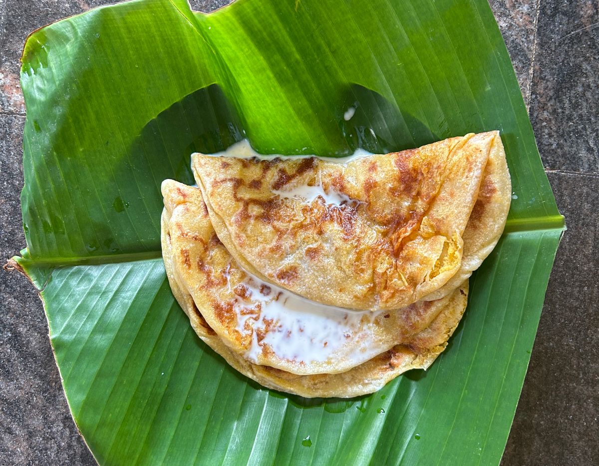 South Indian pancakes served on a fresh banana leaf