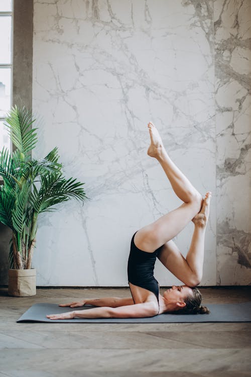 Woman Wearing Black leotard Doing Yoga Pose · Free Stock Photo