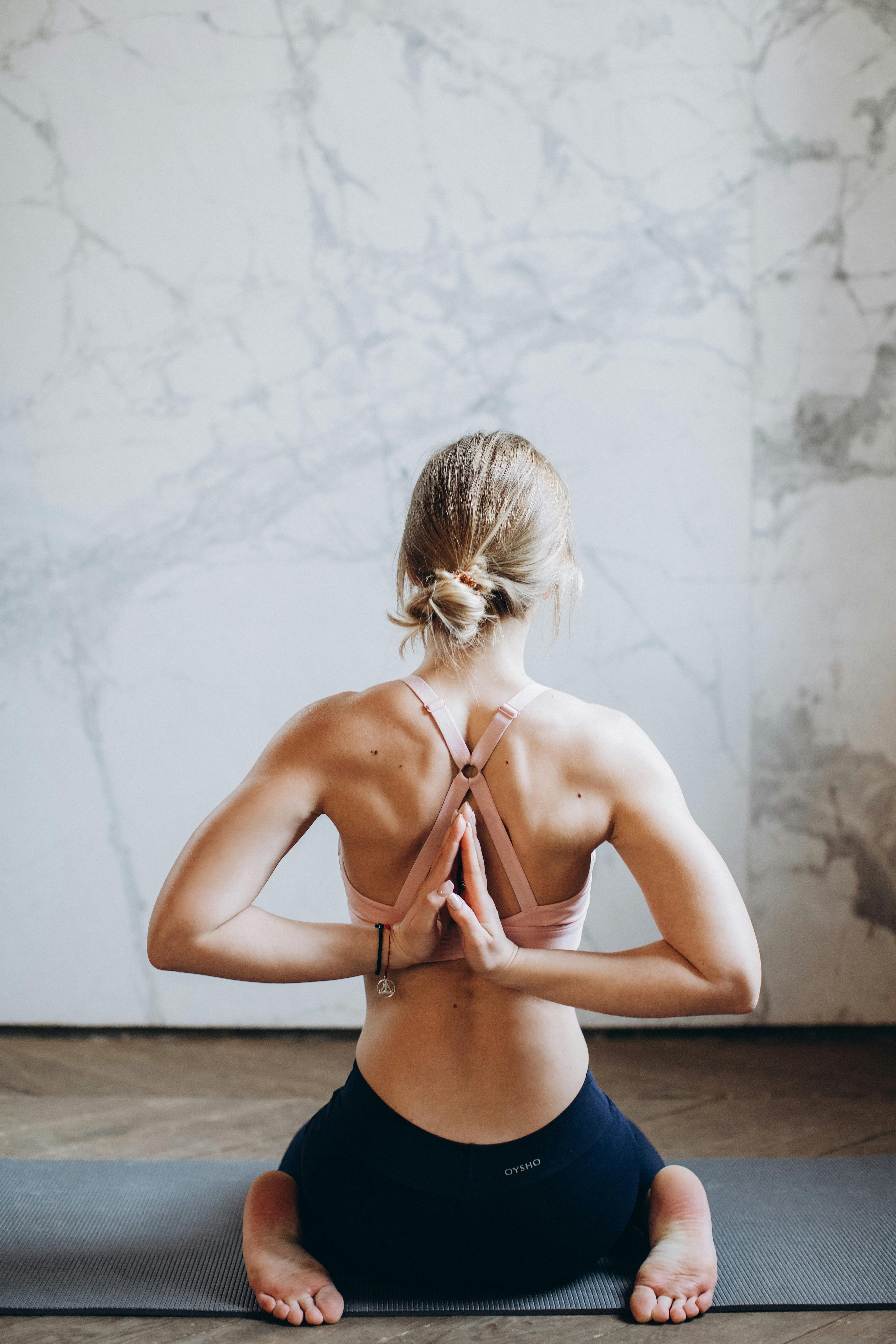 Young Woman Practicing a Yoga Stock Photo - PixelTote