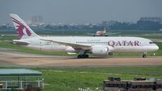 Qatar Airways Boeing 787 Dreamliner taxiing at the airport, showcasing modern aviation technology.