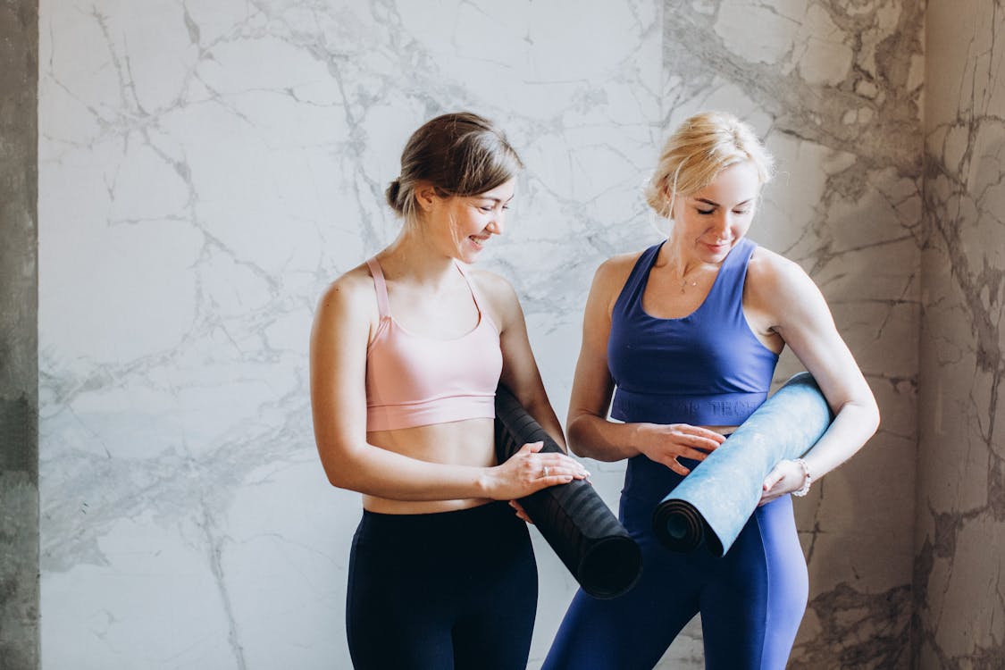 Women Comparing Yoga Mats