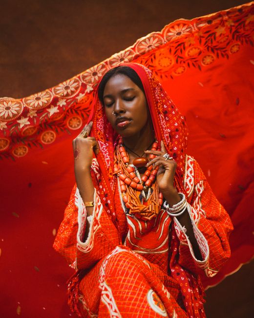 Portrait of a Nigerian woman in vibrant traditional attire celebrating culture.