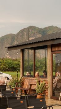 A cozy cafe with mountain views in Perlis, Malaysia. Perfect for relaxing outdoors amidst nature.