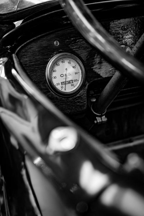 Free Close-up of a vintage car speedometer with elegant dials and shadow play in monochrome. Stock Photo