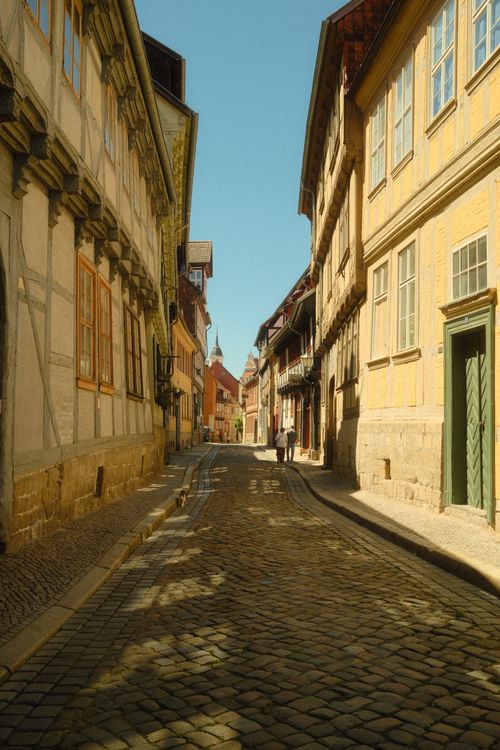 Free Charming cobblestone street in Quedlinburg, Germany with historical half-timbered houses. Stock Photo