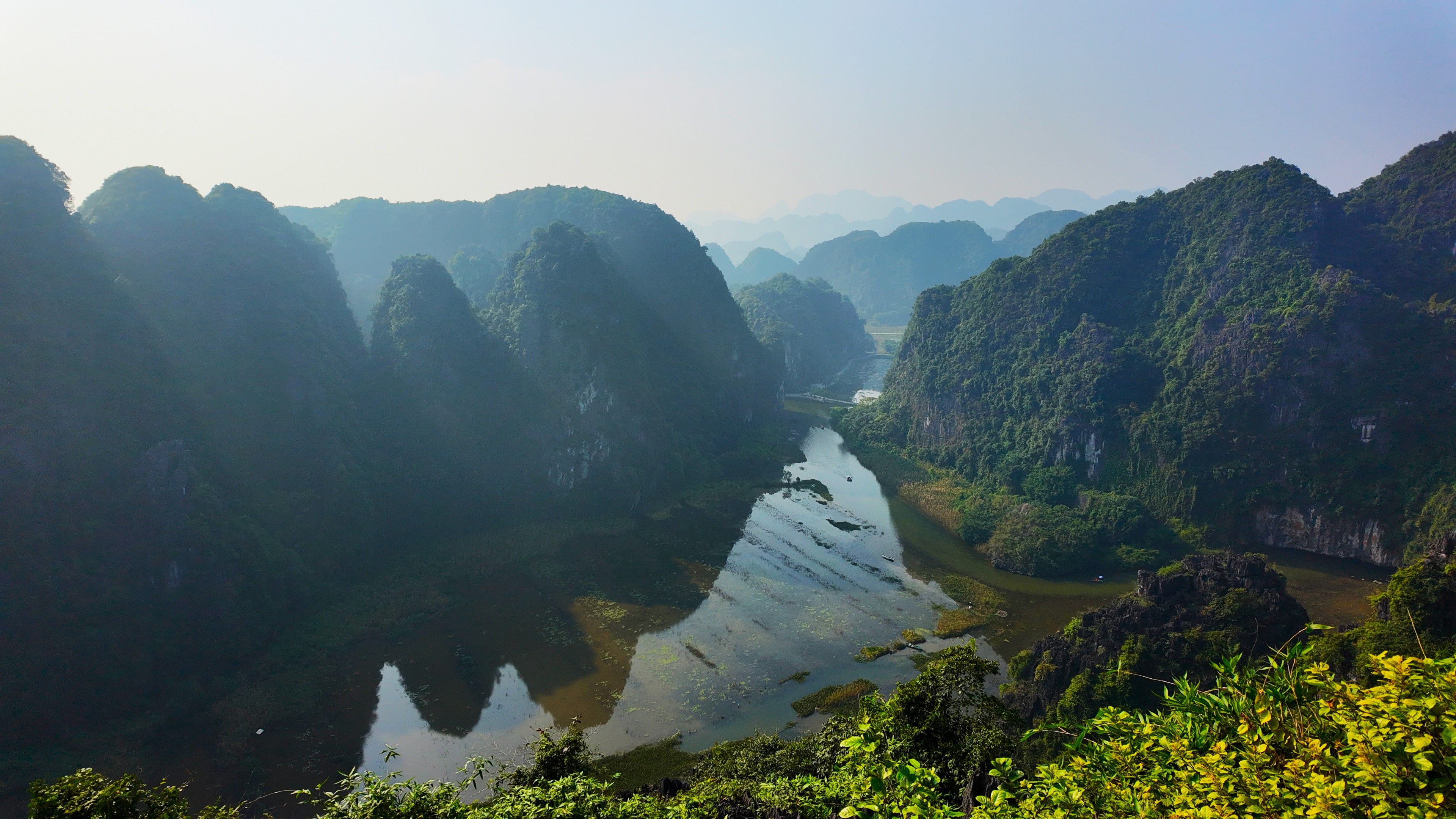 Chasing sunrise and sunset in the Tam Coc rice paddies: a two-day itinerary by bicycle and sampan
