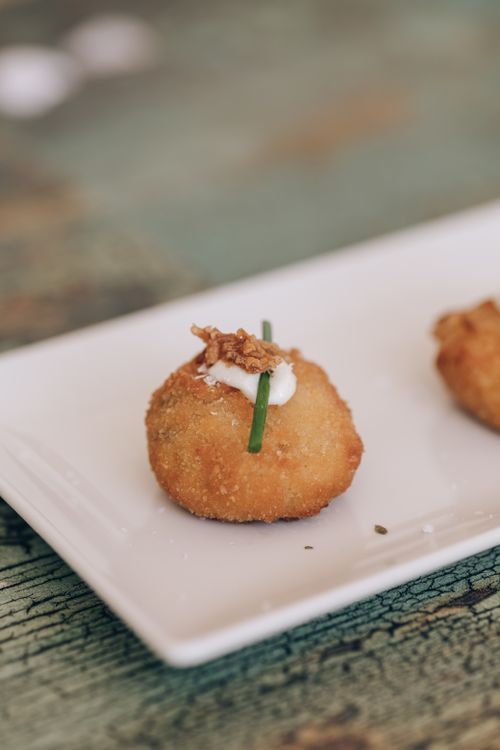 Free Close-up of a gourmet croquette appetizer garnished with herbs. Stock Photo