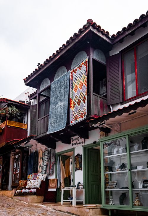 Free Colorful street with traditional textiles hanging in a charming town. Stock Photo