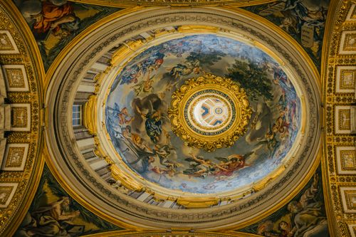 Free Vatican dome ceiling with intricate fresco artwork and gold detailing in Rome, Italy, showcasing classical art. Stock Photo
