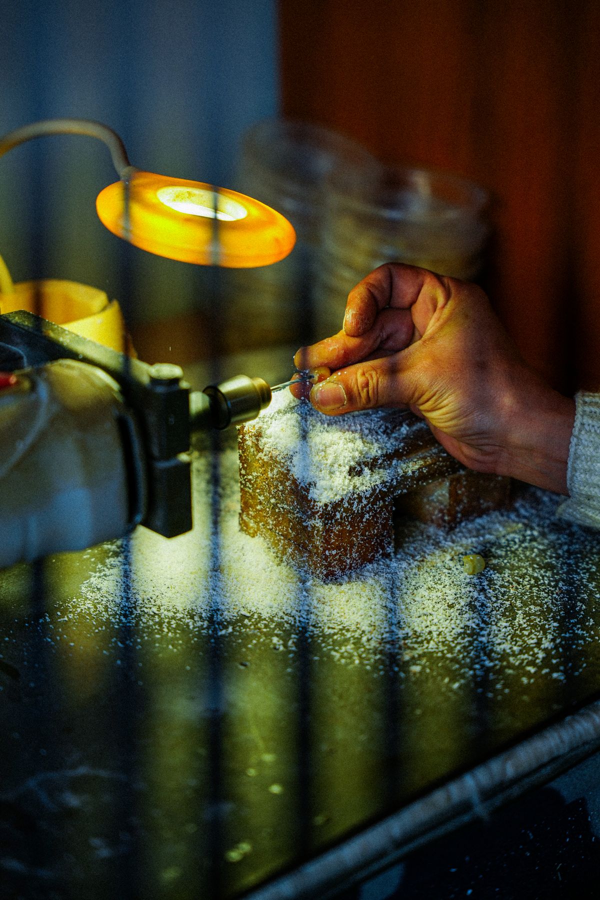 Artisan hand-finishing a gold jewelry piece