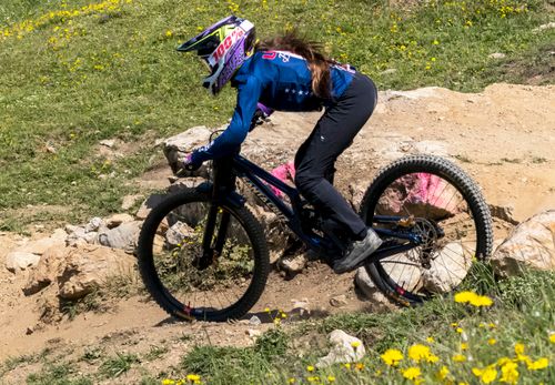 Free A skilled biker descends a rocky trail in Vaz/Obervaz, Switzerland, showcasing mountain biking action. Stock Photo