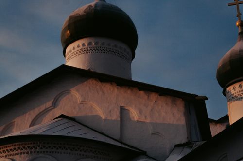 Free A close-up view of a historical Orthodox church dome with intricate architectural details during sunset. Stock Photo
